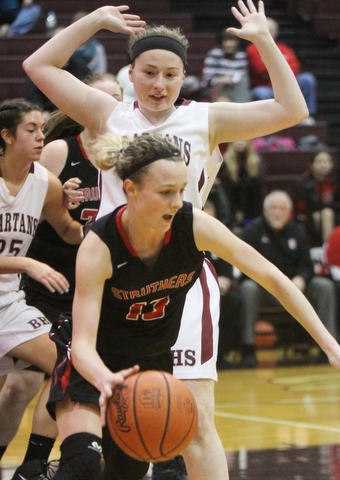 William D. Lewis  The Vindicator  Struthers' Alexis Bury(13) drives past Boardman's Annaliisa Cordova(43)) during 1-10-18 action at Boardman