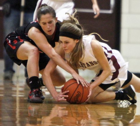 William D. Lewis  The Vindicator  Struthers Michelle Buser(22), left, and Boardman's during 1-10-18 action at Boardman's Cate Green(13) go for a loose ball.