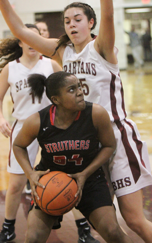 William D. Lewis  The Vindicator  Boardman's (25) guards Struthers Keasia Chism(34) during 1-10-18 action at Boardman