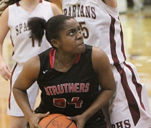 William D. Lewis  The Vindicator  Boardman's (25) guards Struthers Keasia Chism(34) during 1-10-18 action at Boardman