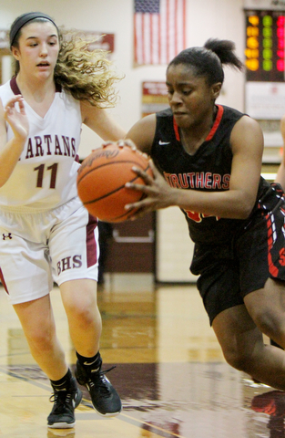 William D. Lewis  The Vindicator  Boardman's Alicia Saxton(11) defends as Struthers'Keasia Chism(34) passes during 1-10-18 action at Boardman
