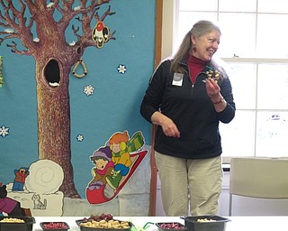 Neighbors | Zack Shively.Guests at the Ford Nature Center made two types of bird feeders on Dec. 28. Pictured, naturalist Marilyn Williams showed the group sample feeders.