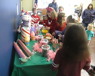 Neighbors | Zack Shively.The Nutcracker party at the Boardman library had a number of different stations for the children to visit. Pictured, children visit "the Land of Sweets" to get a few pieces of candy and a cup of lemonade.