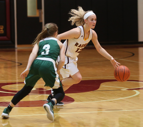 South Range's Bree Kohler (12) dribbles past Ursuline's Jamie Nelson (3) in the first half of an OSHAA girls high school basketball game, Thursday, Jan. 11, 2018, in Canfield. South Range won 54-49...(Nikos Frazier | The Vindicator)
