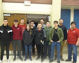 Neighbors | Zack Shively.The Austintown and Canfield robotics teams sat in the Austintown Middle School cafeteria on Jan. 6 for the game reveal for the FIRST Robotics Competition. Pictured is the Austintown robotics team with lead mentor Rick Zimmerman.