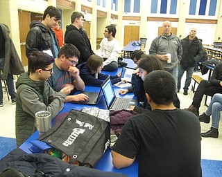 Neighbors | Zack Shively.After the event, the robotics teams began their building process. Canfield will work about four hours after school Monday through Friday and up to 12 hours on weekends and breaks. Austintown will work five hours after school on Monday through Friday and on weekends as needed. Pictured are the Canfield robotics students looking for the best way to score points at the competition.
