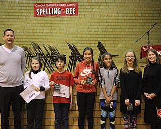 Neighbors | Abby Slanker.Canfield Village Middle School principal Judd Rubin (left) congratulated the 2017 school grand champion and grade level winners at the Canfield Village Middle School Spelling Bee on Dec. 21. Pictured are, from left, sixth-grade champion and runner-up Chloe Campbell, sixth-grader and grand champion Saif Rehman, seventh-grade champion Grace Min, fifth-grade champion Radhika Uppal, eighth-grade champion Julia Mosher and announcer Professor Wendy Pfrenger of Kent State Salem.