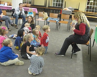 Neighbors | Zack Shively.The Poland library held "The Nutcracker Sweets," a special holiday, event on Nov. 30. Pictured, Parents and children gathered around Jennifer Kuczek while she read "The Nutcracker and the Mouse King."