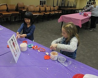 Neighbors | Zack Shively.Kuczek made a good balance between activities and crafts in the room. Pictured is one of the activity stations named "The Sugar Plum Fairy Dough" where the children played with a putty-like substance.
