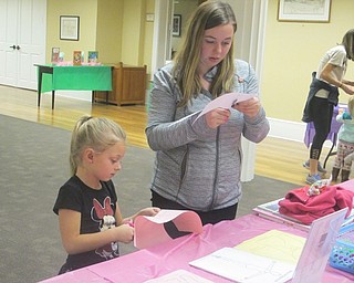 Neighbors | Zack Shively.At the “Princess Pirlipat’s Paper Dolls“ station, the children and families cut out their own paper dolls. To stay with the theme, Kuczek played Pyotr Ilyich Tchaikovsky's "The Nutcracker Suite" during the event.