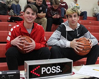 Neighbors | Abby Slanker.Canfield High School sophomore basketball players Jake Kowal (left) and Joey DiGiacomo (right) volunteered to work the scorers table at the fourth annual Canfield Cardinal Classic Boys Basketball Tournament on Dec. 9.