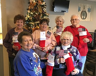 Austintown American Legion Post 301 Women’s Auxiliary recently assembled and delivered Christmas stockings filled with goodies and holiday cheer to veterans in five local nursing homes. Auxiliary members, seated above from left, are Betty Garhammer and Kathy Kirchner, and standing, from left, are Betty Evanosky, Chris Lepley, Linda Melne and Diane Kommel.