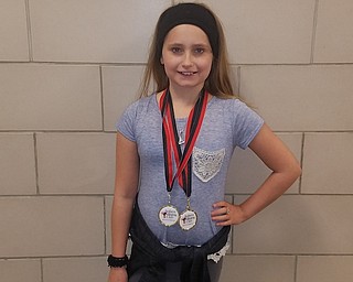 Katelyn Hackett, a fifth-grade student at Brookfield Middle School, recently won two first-place medals in figure skating at the Amherst Skating Club Invitational in Williamsville, N.Y.
