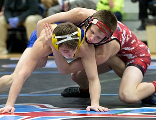 ALLIANCE, OHIO - JANUARY 10, 2018: TOP GUN WRESTLING- Beaver Local's Cole McComas (red) scores against Olentangy's Jacob Sherman (blue) during the 1st period of the113 lbs at Alliance High School.  MICHAEL G TAYLOR | THE VINDICATOR