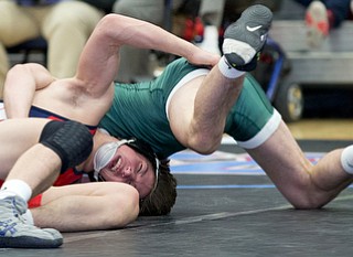 ALLIANCE, OHIO - JANUARY 10, 2018: TOP GUN WRESTLING- Austintown's Wes Sutton (red) makes the winning move against   Musselman's Joey Miller's (green) during OT in the championship 126 lbs match at Alliance High School.  MICHAEL G TAYLOR | THE VINDICATOR