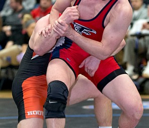 ALLIANCE, OHIO - JANUARY 10, 2018: TOP GUN WRESTLING- Austintown's Michael Feree (red) escapes against  Hoover's Luke Reicosky (black) during OT in the championship 160 lbs match at Alliance High School.  MICHAEL G TAYLOR | THE VINDICATOR