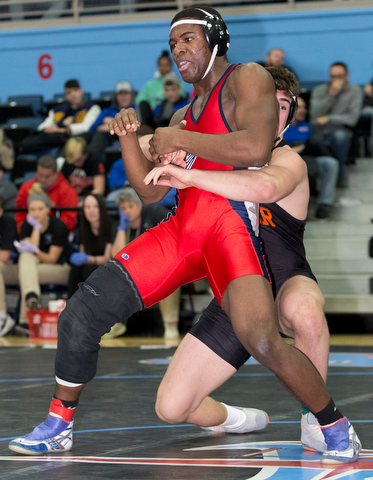 ALLIANCE, OHIO - JANUARY 10, 2018: TOP GUN WRESTLING- Austintown's Breylon Douglas (red) is in the grasp of Hoover'sBen Smith (black) in the championship 195 lbs match at Alliance High School.  MICHAEL G TAYLOR | THE VINDICATOR