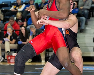 ALLIANCE, OHIO - JANUARY 10, 2018: TOP GUN WRESTLING- Austintown's Breylon Douglas (red) is in the grasp of Hoover'sBen Smith (black) in the championship 195 lbs match at Alliance High School.  MICHAEL G TAYLOR | THE VINDICATOR