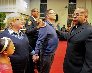 William D. Lewis The Vindicator David and Pat Leo, parents of slain Girard Police officer Justin Leo, stand with Warren PD captain Jeff Cole and Rev. Anthony Davis of Warren whio is a retired OHSP trooper, during a MLK ceremony at Second Baptist Church in Warren 1-14-18. A group of police officers were part of the ceremony to help better understanding between law enforcement and community. At left is London Johnson, 9, daughter of Rev Todd Johnson, pastor of 2nd Baptist.