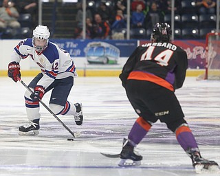 Team USA forward Jake Wise (12) skates towards Youngstown Phantoms defenseman Gianfranco Cassaro (44) in the first period of an USHL regular season hockey game, Monday, Jan. 15, 2018, in Youngstown. Team USA won 7-1...(Nikos Frazier | The Vindicator)