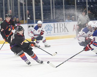 Youngstown Phantoms forward Chase Gresock (19) steals the puck from Team USA defenseman Spencer Stastney (25) in the first period of an USHL regular season hockey game, Monday, Jan. 15, 2018, in Youngstown. Team USA won 7-1...(Nikos Frazier | The Vindicator)