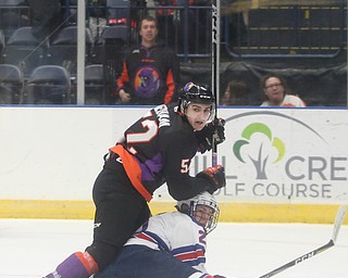 Youngstown Phantoms center Craig Needham (52) falls down onto Team USA defenseman Spencer Stastney (25) in the first period of an USHL regular season hockey game, Monday, Jan. 15, 2018, in Youngstown. Team USA won 7-1...(Nikos Frazier | The Vindicator)