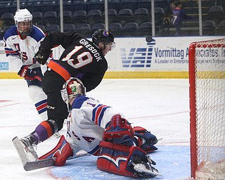 Youngstown Phantoms forward Chase Gresock (19) watches as his shot is deflected by Team USA goalie Drew DeRidder (1) in the second period of an USHL regular season hockey game, Monday, Jan. 15, 2018, in Youngstown. Team USA won 7-1...(Nikos Frazier | The Vindicator)