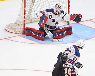 Team USA goalie Drew DeRidder (1) deflects a shot as Youngstown Phantoms forward Chase Gresock (19) and Team USA defenseman Mattias Samuelsson (23) watch onin the third period of an USHL regular season hockey game, Monday, Jan. 15, 2018, in Youngstown. Team USA won 7-1...(Nikos Frazier | The Vindicator)