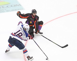 Youngstown Phantoms defenseman Andrew Petrillo (5) slides down to block Team USA forward Oliver Wahlstrom (18)'s shot in the third period of an USHL regular season hockey game, Monday, Jan. 15, 2018, in Youngstown. Team USA won 7-1...(Nikos Frazier | The Vindicator)