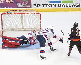 Team USA goalie Drew DeRidder (1) and Team USA defenseman DJ King (27) leap to deflect Youngstown Phantoms forward Matthew Barry (26)'s shot in the third period of an USHL regular season hockey game, Monday, Jan. 15, 2018, in Youngstown. Team USA won 7-1...(Nikos Frazier | The Vindicator)