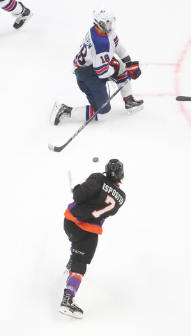 Youngstown Phantoms left wing Eric Esposito (7) shoots at Team USA forward Oliver Wahlstrom (18) in the third period of an USHL regular season hockey game, Monday, Jan. 15, 2018, in Youngstown. Team USA won 7-1...(Nikos Frazier | The Vindicator)