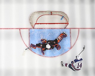 Team USA forward Jack DeBoer (14) scores a goal past Youngstown Phantoms goalie Wouter Peeters (36) in the third period of an USHL regular season hockey game, Monday, Jan. 15, 2018, in Youngstown. Team USA won 7-1...(Nikos Frazier | The Vindicator)