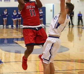 Austintown Fitch guard Emaniel Dawkins (11) goes up for two in the third quarter of an AAC high school basketball game, Tuesday, Jan. 16, 2018, in Poland. Poland won 70-56...(Nikos Frazier | The Vindicator)