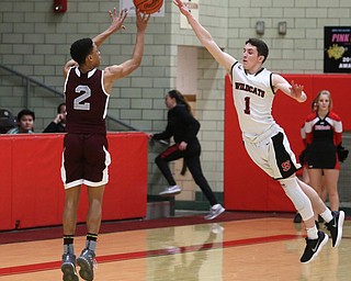 Boardman guard Ryan Archey (2) goes up for three as Struthers' Isaiah Torrence (1) attempts to block his shot in the second quarter of an AAC high school basketball game, Tuesday, Jan. 16, 2018, in Struthers. Boardman won 71-48...(Nikos Frazier | The Vindicator)