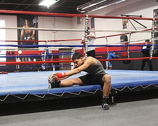 Brayan Colon stretches before working out, Tuesday, Jan. 16, 2018, at the Southside Boxing Gym in Youngstown...(Nikos Frazier | The Vindicator)