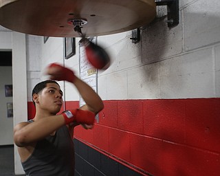 Brayan Colon works the speed bag, Tuesday, Jan. 16, 2018, at the Southside Boxing Gym in Youngstown...(Nikos Frazier | The Vindicator)