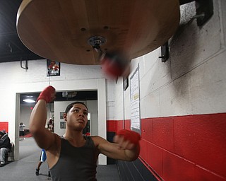 Brayan Colon works the speed bag, Tuesday, Jan. 16, 2018, at the Southside Boxing Gym in Youngstown...(Nikos Frazier | The Vindicator)