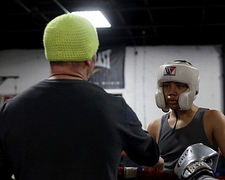 Brayan Colon waits as trainer Vinny O'Neil gives him feedback, Tuesday, Jan. 16, 2018, at the Southside Boxing Gym in Youngstown...(Nikos Frazier | The Vindicator)