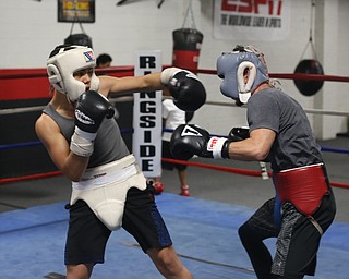 Brayan Colon(white) spars with Carlos Gaerena Morales(red), Tuesday, Jan. 16, 2018, at the Southside Boxing Gym in Youngstown...(Nikos Frazier | The Vindicator)