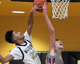 William D. Leiws The Vindicator  Harding'sDom McGhee(23) and Kennedy's Ben Taylor (32) battle for a rebound during 1-17-18 action at Harding.