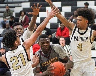 William D. Lewis The Vindicator Kennedy's Oscar Tshiebwe(50)  is hemmed in by Harding'sTyre Marlowe(21) Terrion Jackson(1) and Chris Hughes(4) during 1-17-18 action at Harding