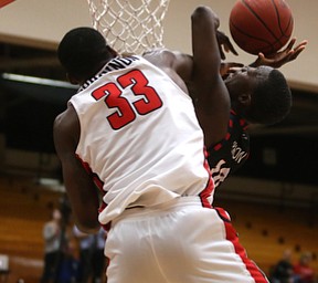 UIC guard Dikembe Dixson (10)'s layup is blocked under the net by Youngstown State forward Naz Bohannon (33) in the first half of a NCAA college basketball game, Thursday, Jan. 18, 2018, in Youngstown. UIC won 92-78...(Nikos Frazier | The Vindicator)