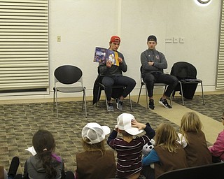 Neighbors | Zack Shively.Players from the Youngstown Phantoms hockey team read stories to children at the Austintown library on Jan.9. Pictured, Liam Dennison read "Z is for Zamboni" by Matt Napier.