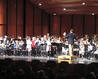 Neighbors | Zack Shively.The fifth-grade concert band performed different songs from their instructional book including songs like "Itsy Bitsy Spider" and "London Bridge." Each section of the band played small sectional songs. Pictured, the clarinets stood and played a small song to show what they have learned thus far in class.