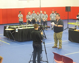 Neighbors | Zack Shively.Andy Yates, the tournament partner and a mentor with Austintown robotics, gave the teams and audience an introduction to the competition and how the teams would be scored.