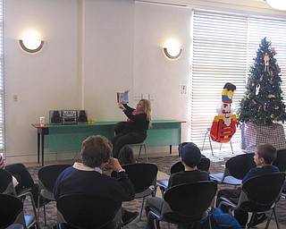 Neighbors | Zack Shively.Librarian Jennifer Kuczek read "“The Nutcracker and the Mouse King“ by E.T.A. Hoffmann as a part of the "Nutcracker Sweets" program at the Austintown library on Dec. 9.