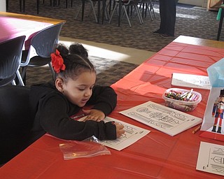 Neighbors | Zack Shively.The "Nutcracker Sweets" party was a celebration of all things Nutcracker-related. The Austintown library had a number of stations set up, including the "Color the Nutcracker." Pictured is Annabella Miner coloring.