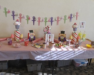 Neighbors | Zack Shively.Fittingly, Jennifer Kuczek had a table of sweets for the "Nutcracker Sweets" party at the Austintown library. The station, named "The Land of Sweets," had mints, chocolate and other candies as well as lemonade.