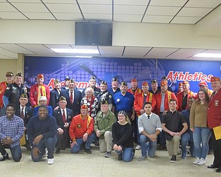 Neighbors | Zack Shively.Students Michael Ferree, Nate Armstrong, Catlin Correia, Dylan Correia, Katilyn Carson, Breylon Douglas and Jakari Lumsden organized the event with the help of the school. Pictured are the veterans and the group of seniors who organized the event.