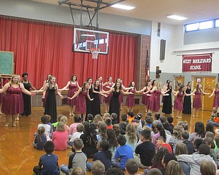 Neighbors | Zack Shively.The Boardman High School Choir traveled between the four elementary schools. They had four performances from the Boardman Singers, an all-female choir; the Spartan Singers, an all-male choir; a chorale, which combined certain members from both groups; and a final performance of everyone in the choir. Pictured, the Boardman Singers sang "Do You Want to Build a Snowman?"